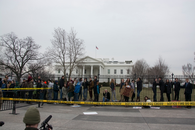 Protesters await arrest in front of the White House. March 2, 2014. Sean Davis